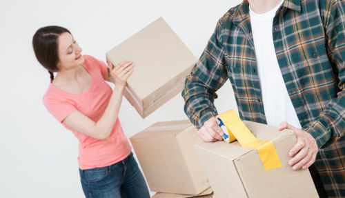 Removal van and moving boxes prepared for an East Ham home move
