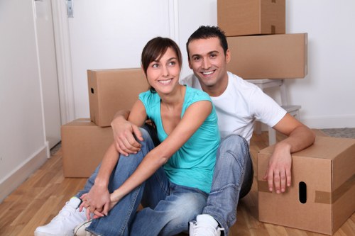 Removal team handling household items carefully