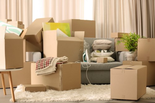 Careful unloading of boxes and furniture at a new Eastham property