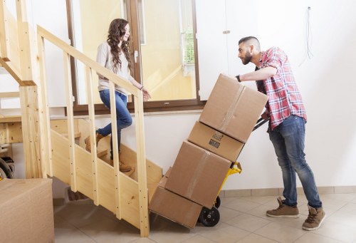 Team handling boxes and access challenges for an Eastham move