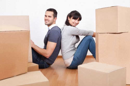Professional movers handling desks and office furniture