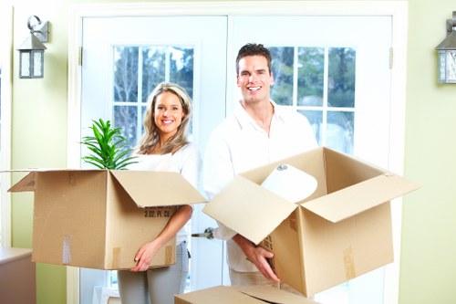 Packing and labelling office items for a move in Eastham