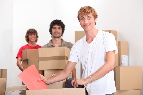 Removals team carrying boxes during a local Eastham move